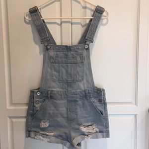 Distressed jean overalls